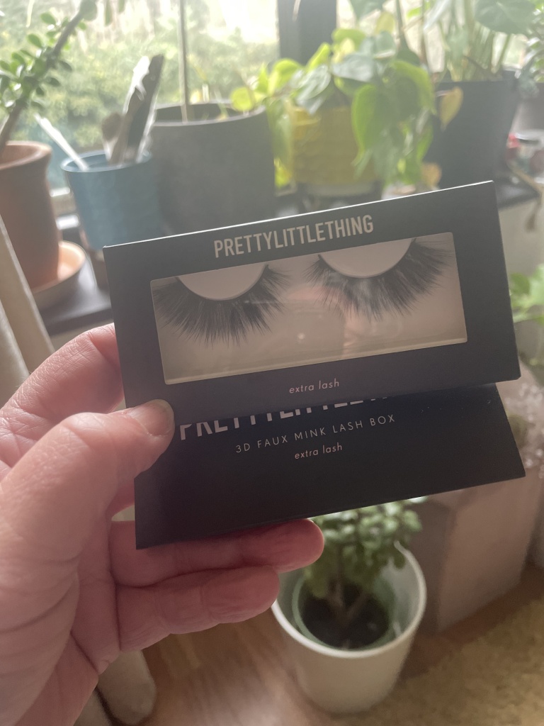 Pretty Little Thing false eyelashes that look super extra long to me